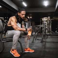 A quiet moment of reflection in the gym after a hard session. This is where you recharge and prepare for the next challenge.