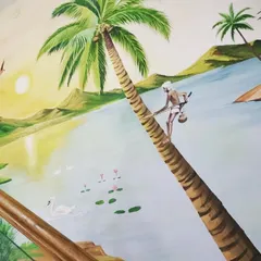 A hand-painted mural depicting a classic tropical beach scene. I focused on details like the texture of the palm tree and the gentle waves to bring a sense of tranquility and escape to the space.