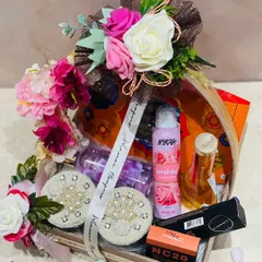 Sway her mood and make her smile with this amazing personalized gift hamper. It features Nykaa and MAC cosmetics, beautifully arranged in a decorative tray with flowers.