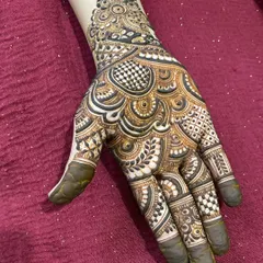 A lovely design for the back of the hand, featuring a mix of checkerboard patterns and swirling paisleys.