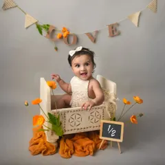 Celebrating a half-birthday. Sitter sessions are a wonderful way to mark these fun milestones. This little girl's happy expression is absolutely priceless.