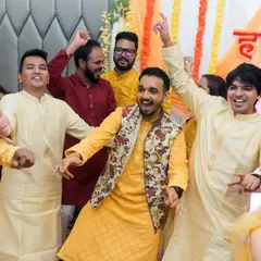 The groom and his friends owning the dance floor during the Sangeet ceremony. We capture the energy and excitement of the performances.