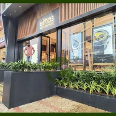 Here is another view of the entrance we designed for the Ethos watch boutique. The layered planting with different heights and shades of green creates a dynamic and inviting look that enhances the building's modern architecture.
