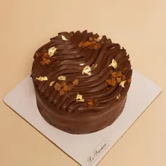 This is my Belgian Chocolate Crunch Cake. I layer soft chocolate sponge with smooth Belgian chocolate ganache and add Callebaut feuilletine for a delightful, crispy texture in every bite.