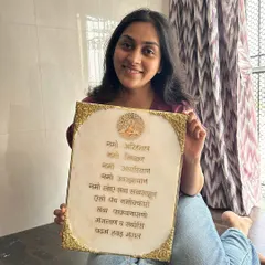 A happy client with her custom Navkar Mantra frame. It's an honor to create pieces that hold such special meaning.
