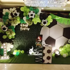 I brought the stadium to the party with this action-packed football theme. The setup featured a turf-like green wall, a massive soccer ball prop, a neon 'Happy Birthday' sign, and light-up marquee numbers, making it the ultimate celebration for a young sports fan.