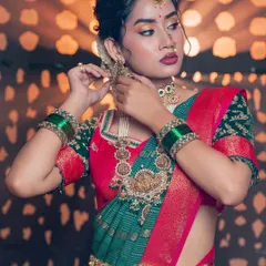 Adding a touch of Diwali sparkle to the eyes. This festive look combines a bold lip with shimmering gold eyeshadow for an elegant, celebratory feel.