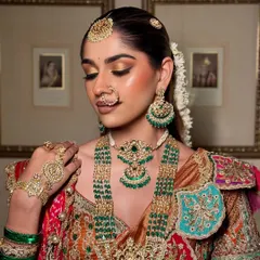 Bringing to life the timeless beauty of a South Indian bride. The golden shimmer on the eyes complements the temple jewellery perfectly.
