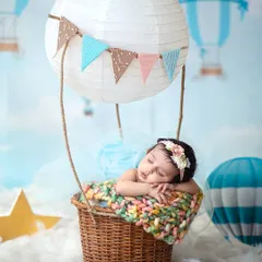 Up, up, and away into dreamland. I love creating whimsical setups like this hot air balloon adventure, turning a simple portrait into a storybook moment.
