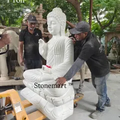 Our artisans preparing the 1-ton white marble Buddha statue for display. This piece is designed as a significant garden sculpture, bringing a sense of peace and grandeur to any large outdoor space.