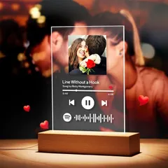 Capture your special song forever with a personalized music plaque. I engrave your photo and the song details onto a clear acrylic plaque with a wooden stand, creating a beautiful desk ornament that links directly to your music.