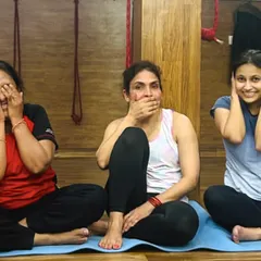 The three wise monkeys, yoga style. A playful moment of 'see no evil, speak no evil, hear no evil' during a studio session.