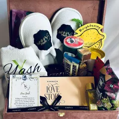 Celebrate the main man with our ultimate groom hamper. This personalized trunk includes custom monogrammed slippers and a towel for 'Yash', alongside premium grooming products and snacks, making it the perfect pre-wedding indulgence.