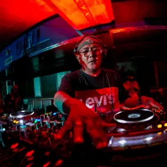 On the ones and twos at Raasta Delhi. The red lights and packed house create an intense vibe that I feed off of all night long.