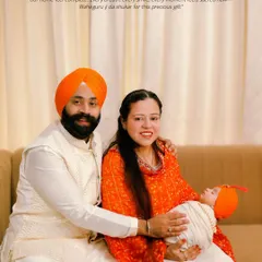 A beautiful birth announcement for a Sikh family, featuring a family portrait and the sacred 'Ek Onkar' symbol. It's a wonderful way to share the news of their blessing while honoring their faith.