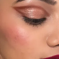 A close-up look at a shimmery bronze eyeshadow with a sharp wing. This is a versatile eye makeup style that you can learn to master for both everyday wear and special occasions.