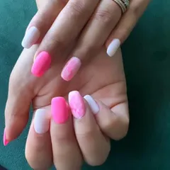 A mix-and-match set featuring solid matte pink, solid white, and a marbled pink and white accent nail.