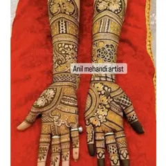 A beautiful example of symmetrical bridal mehandi. Both hands feature matching floral and peacock designs, creating a balanced and traditional look for the bride.