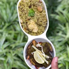 The perfect pairing: my Thuppangadi Biriyani served alongside the spicy Torpedo Chilli Kebab. The rich, ghee-infused biriyani complements the fiery kick of the kebab, creating a balanced and unforgettable meal.