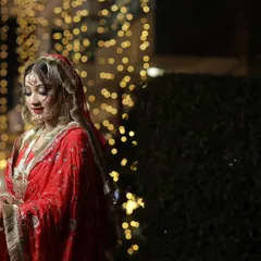 A soft, elegant portrait of the bride. Her gentle smile and the beautiful lighting create a timeless and graceful image.