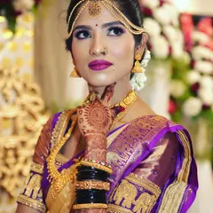 We focus on capturing the elegance of our brides. This is a classic South Indian bridal portrait, highlighting the intricate details of the Kanjeevaram saree, temple jewellery, and flawless makeup.