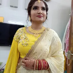 Another angle of this beautiful anniversary look, showing how the makeup looks from the side. The contouring is soft and the updo hairstyle keeps the focus on her face and jewelry.