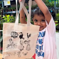 Look at that proud smile! I love seeing little artists bring their imagination to life. In this block printing session, we used safe, non-toxic inks to create wearable art that also teaches about our beautiful animal kingdom.