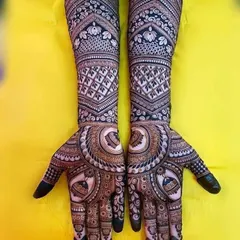 This full-hand design showcases a mix of popular traditional elements. It includes checkerboard patterns, floral bands, and a central circular motif for a classic bridal style.