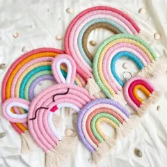 I seriously can't get over how beautiful these pastel rainbows are! 🌈 This flat lay shows the different sizes and styles I offer, from large wall hangings to tiny keychains and even a cute bunny-eared rainbow.