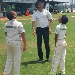 An umpire and two U-12 captains at the toss, a crucial learning experience in leadership and sportsmanship.