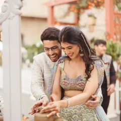 A couple gets their hands dirty at a live pottery station during their Parisian-themed Mehendi. Interactive activities like this are a great way to engage guests and create lasting memories.