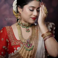 This shot highlights the harmony between the makeup, the rich gold jewelry, and the traditional attire. Notice the clean lines of the eye makeup and the smooth, non-cakey finish of the skin, which are hallmarks of my style.