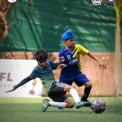A perfectly timed slide tackle shows the commitment and defensive skill on display in our youth football tournament.