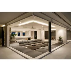 This sunken lounge area is a unique feature we designed for a client seeking a cozy and intimate gathering space. The low seating and warm, indirect lighting create a relaxed and modern conversational pit.