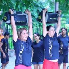 Strength comes in many forms, and here, it comes with a smile. My functional bootcamp sessions use equipment like sandbags to build real-world power. It's about becoming strong for life, not just for the gym.