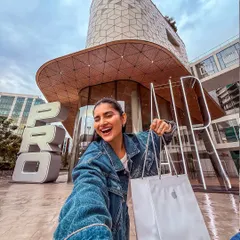 A selfie celebrating the new iPhone 17 Pro. I create authentic, on-the-go content that feels personal and relatable, just like an excited customer picking up their new device.