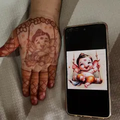 A side-by-side comparison of the reference image and my henna portrait of baby Ganesha. I take great pride in capturing the details and the joyful spirit of the figures I create.