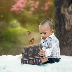 A magical moment in the woods, where a little boy discovers butterflies coming out of a book. We love adding a touch of fantasy to our outdoor shoots.