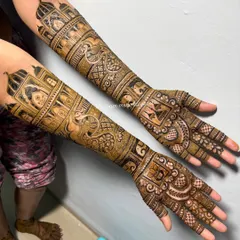 A traditional bridal mehendi featuring architectural elements and peacock motifs.