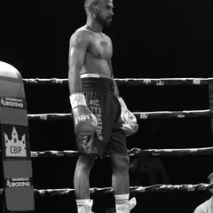 Before the punch comes belief. A quiet moment of focus for a fighter in the ring before the bell rings.