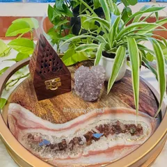 Styled with an incense burner and a crystal cluster, this tray becomes a centerpiece for a serene and mindful space.