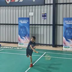 A young player trying out a new racket during the Yonex Demo Day. These events provide a great opportunity for my students to experience professional-grade equipment firsthand.