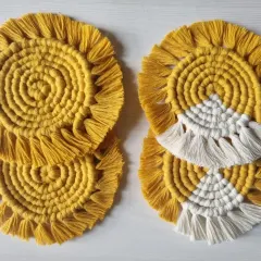I offer my spiral coasters in different color variations, including solid yellow and a two-tone yellow and white design.