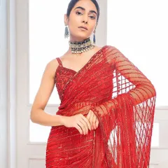 A clean and graphic look for a fashion shoot. The sleek hair and sharp makeup complement the lines of the sequined saree, creating a look that is both modern and timelessly elegant.
