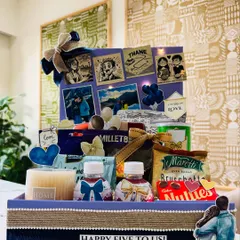 This hamper celebrates a love story that is always rising higher. It commemorates five years since a proposal over Niagara Falls, filled with personalized details and fairy lights to add a touch of magic.