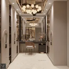 A beautiful place to sit and get ready sets a positive tone for the day. This walk-in closet features a sleek vanity, mirrored wardrobes, and a stunning modern chandelier.