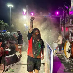 Pattaya, you were a beautiful chaos! A shot of our frontman raising his fist in triumph after a wild Holi performance in Thailand.