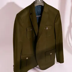 Our olive green coat is designed to be both stylish and practical. Made from a premium, breathable fabric, it's a versatile essential for any wardrobe.