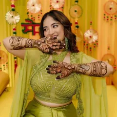 Nothing makes me happier than seeing a client light up with joy. Here's a happy client at her mehendi function, showing off her full-coverage henna. The design is perfect for the festive, celebratory atmosphere.