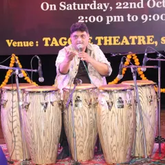 The great Nitin Shankar ji leading his percussion ensemble at the Ustad Alla Rakha Sangeet Sammelan. I am on the left, playing tabla as part of this powerful rhythmic story.